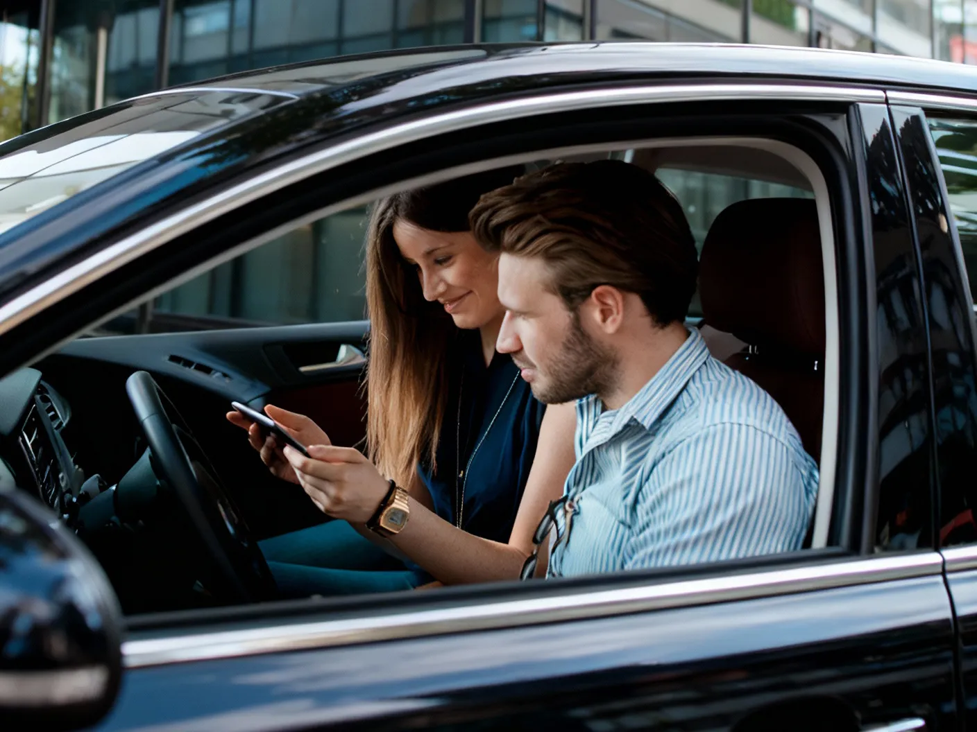 Driver and passenger viewing the carpooling app
